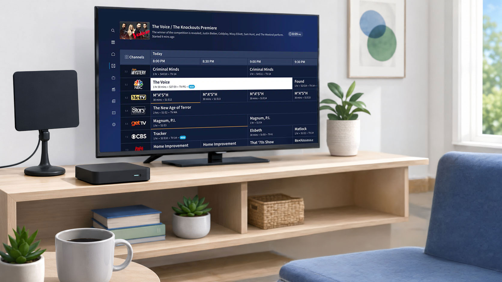 Living room with an antenna, DVR device, and television guide interface showing local TV channels.